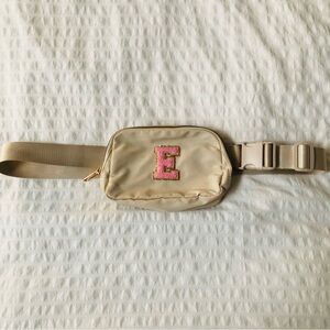 Beige Nylon Adjustable Over the Shoulder Belt Bag With An Initial 'E' Pink Patch